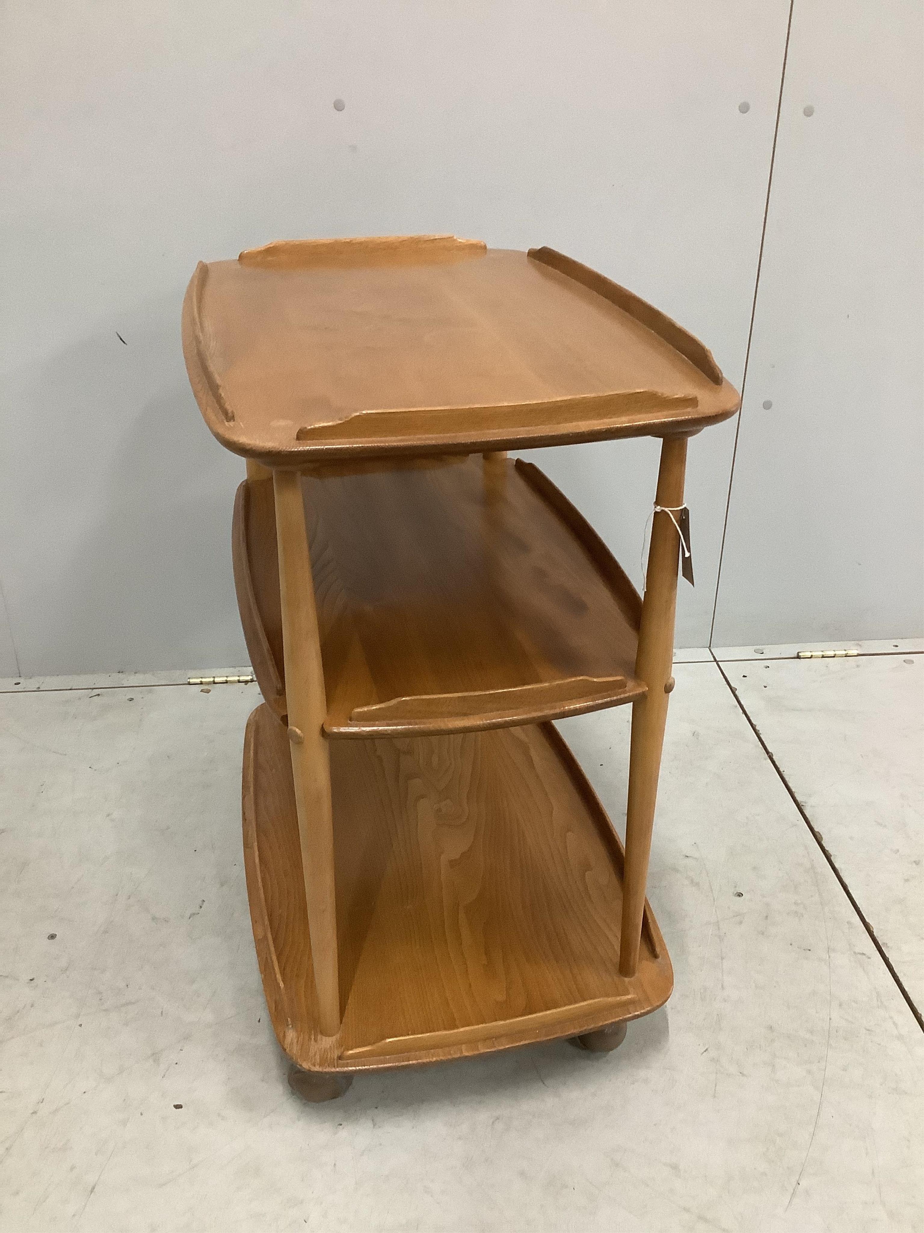 An Ercol Windsor elm three tier trolley, width 71cm, depth 46cm, height 76cm. Condition - fair, top ring-marked